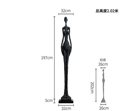 Black slender figurine sculpture with textured surface and elongated form displayed as living room home decor