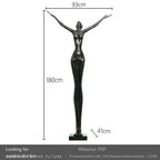 Black frp sculpture of a woman with arms outstretched on a rectangular base for living room home decor