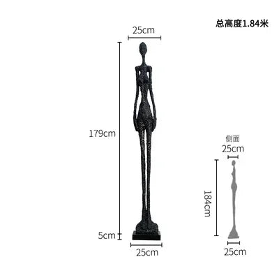 Black slender figurine sculpture with elongated limbs and minimalist design enhances living room home decor