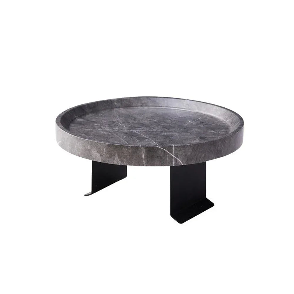 Sofa tray table featuring a circular dark gray marble tray with sleek black metal legs for small spaces