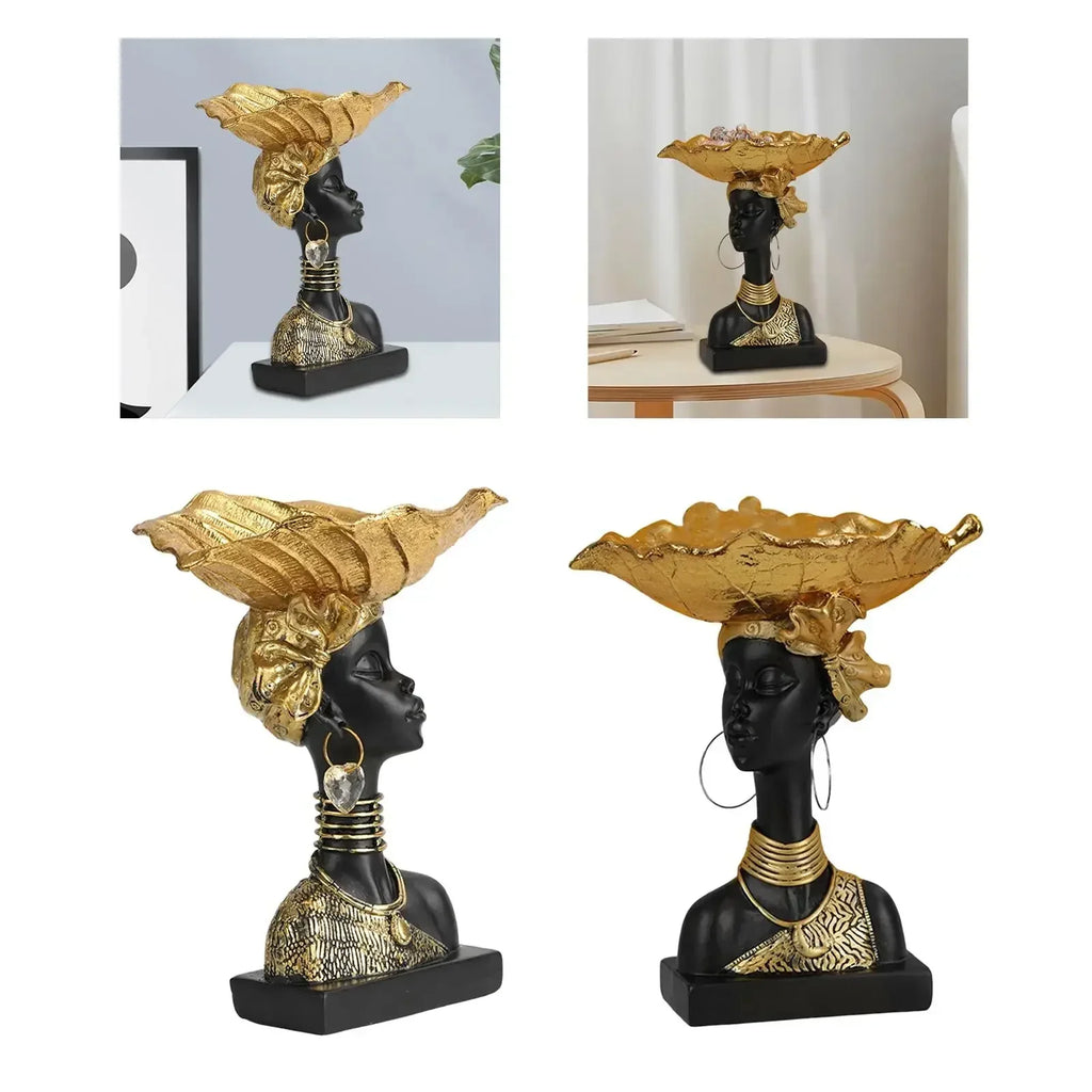 Black and gold african-inspired decorative wooden bust with golden headpiece on a modern style storage tray small