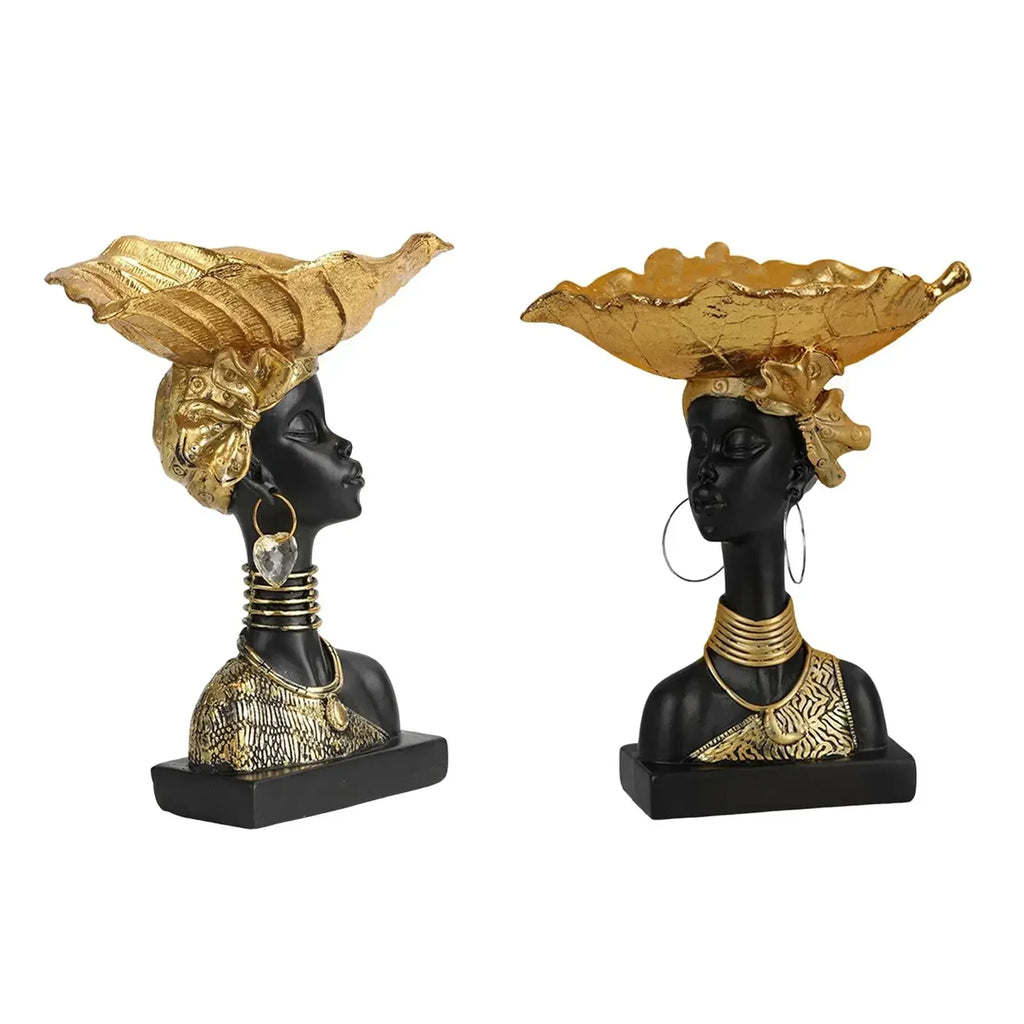 Decorative wooden storage tray featuring black resin busts with gold leaf headdresses in modern style design