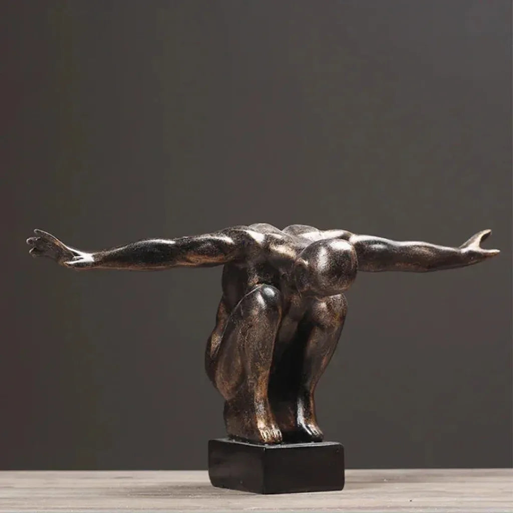 Bronze-colored metallic thinker statue with arms outstretched on black base modern nordic decor for home decor