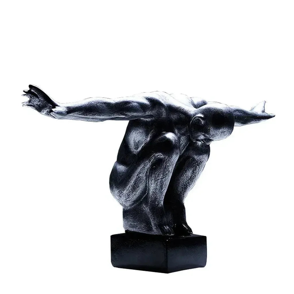 Black resin thinker statue of a crouching figure with arms outstretched for modern nordic decor and home decor