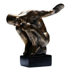 Bronze-colored thinker statue resin art sculpture in dynamic diving pose on black base for modern nordic decor and home decor