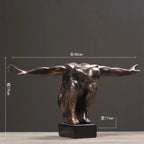 Bronze-finished thinker statue of a muscular man in acrobatic pose on black base for modern nordic home decor