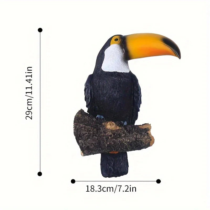 Toucan figurine on a branch with measurements on a white background