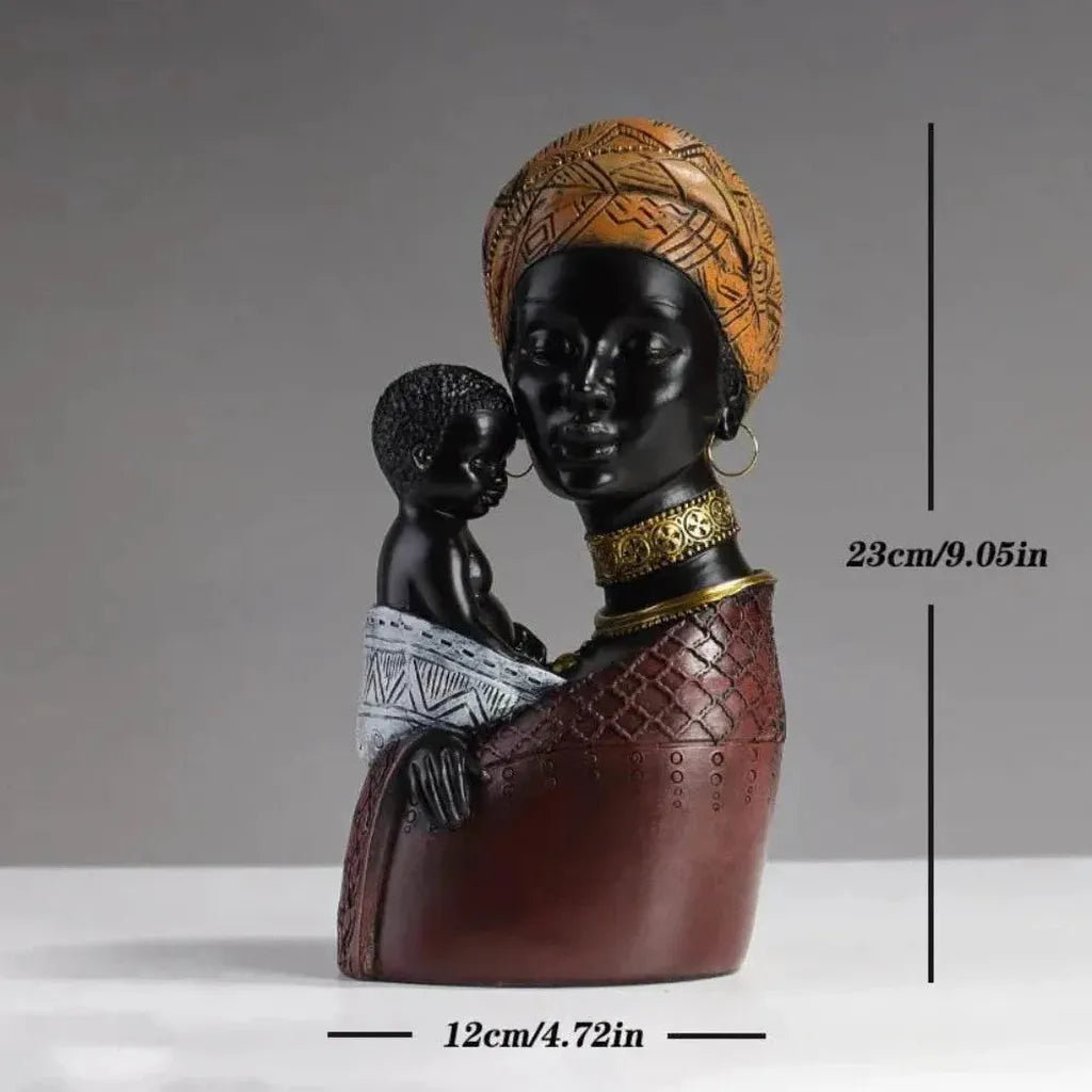 Traditional african mother and child resin sculpture with glossy black finish orange headwrap and gold-trimmed collar