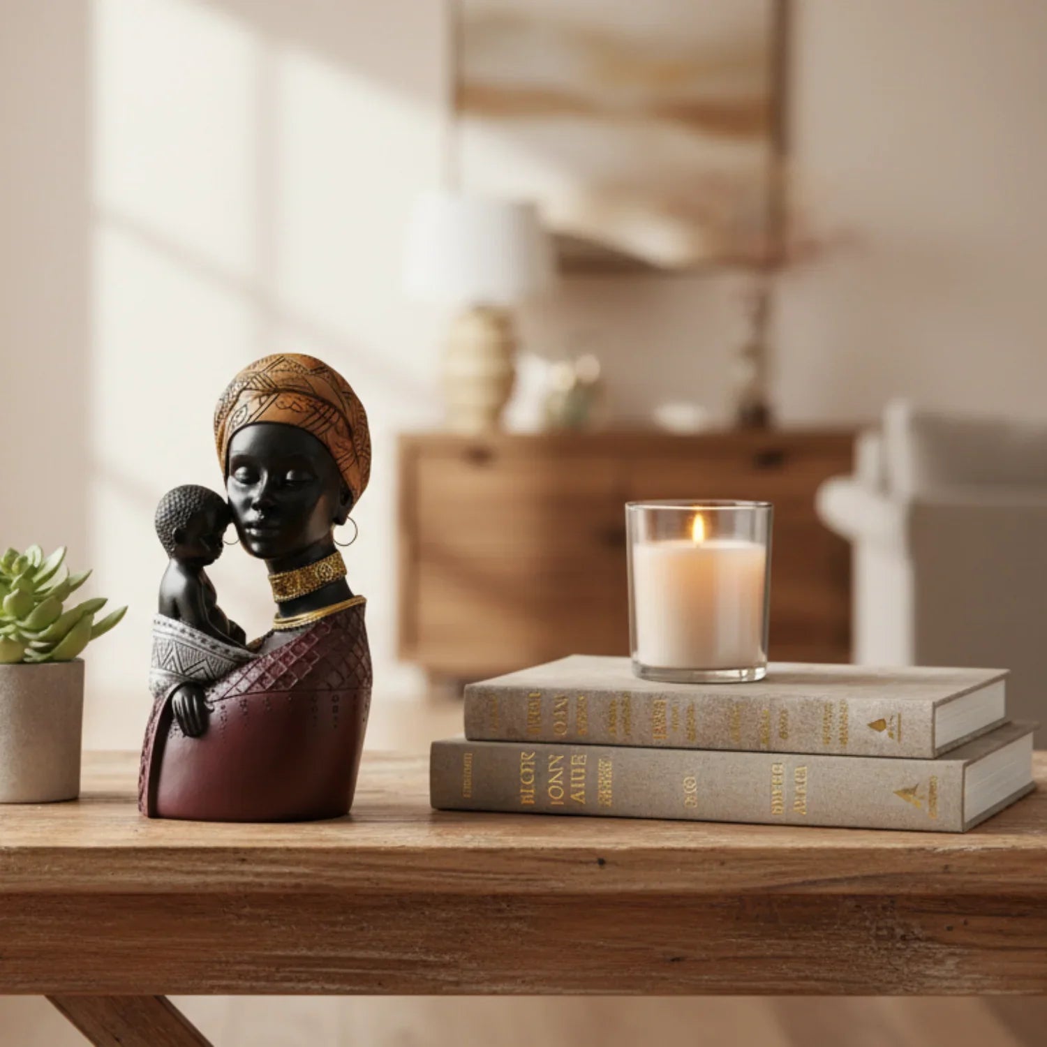 Dark brown resin figurine of a traditional african mother with golden headwrap holding a child with detailed features