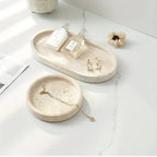 One Piece of Natural Travertine Stone Vanity Tray Designed for Bathroom Use, Perfect for Organizing Perfumes And Cosmetics. This Round Decorative Tray in Beige Is Also Suitable for Kitchen Organization And Home Decor. House Of Avana [[SKU:HOA-TRK-001]]