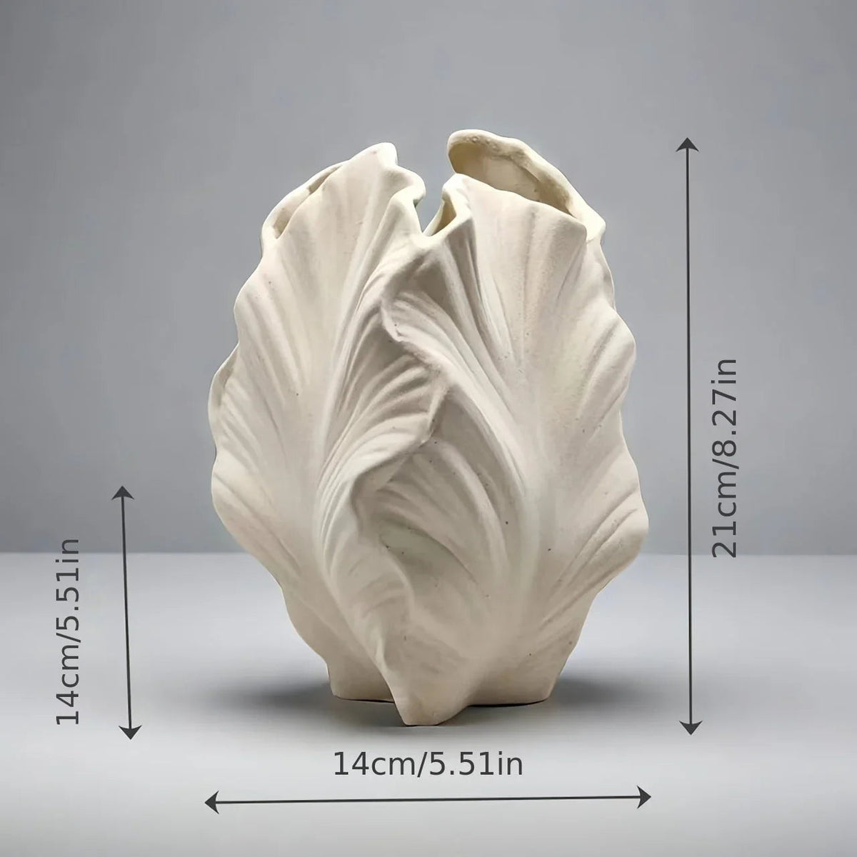 Ceramic White Oval Vase with Textured Leaf Design, angled view - House Of Avana [[SKU:HOA-VAS-010]]
