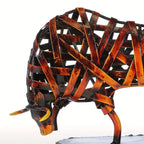 Rustic woven metal bull sculpture with rich amber and dark brown patina a unique metal animal iron art piece