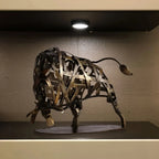Woven metal bull sculpture with rustic finish and intricate lattice design as a unique metal animal decor piece