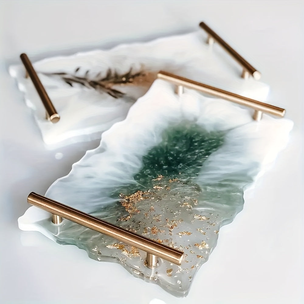 Two decorative trays with gold handles on a light background