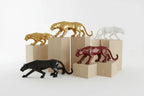 Decorative animal figurines on blocks with a white background