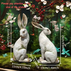 Set of two hand-painted long-eared rabbit statues with a yellow and white moss texture for seasonal home decor.