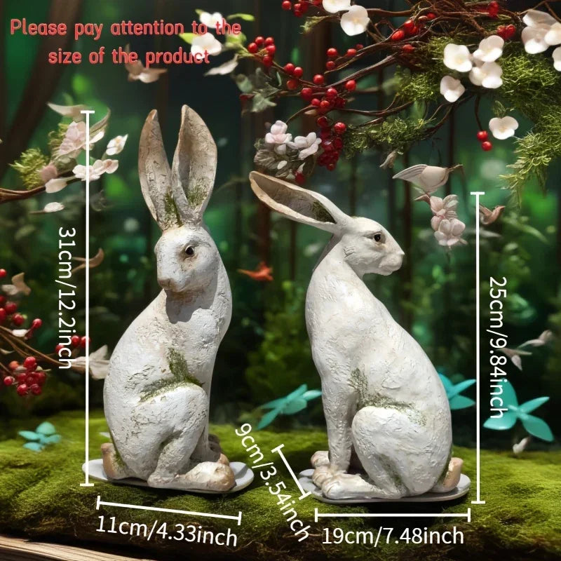 Set of two hand-painted long-eared rabbit statues with a yellow and white moss texture for seasonal home decor.