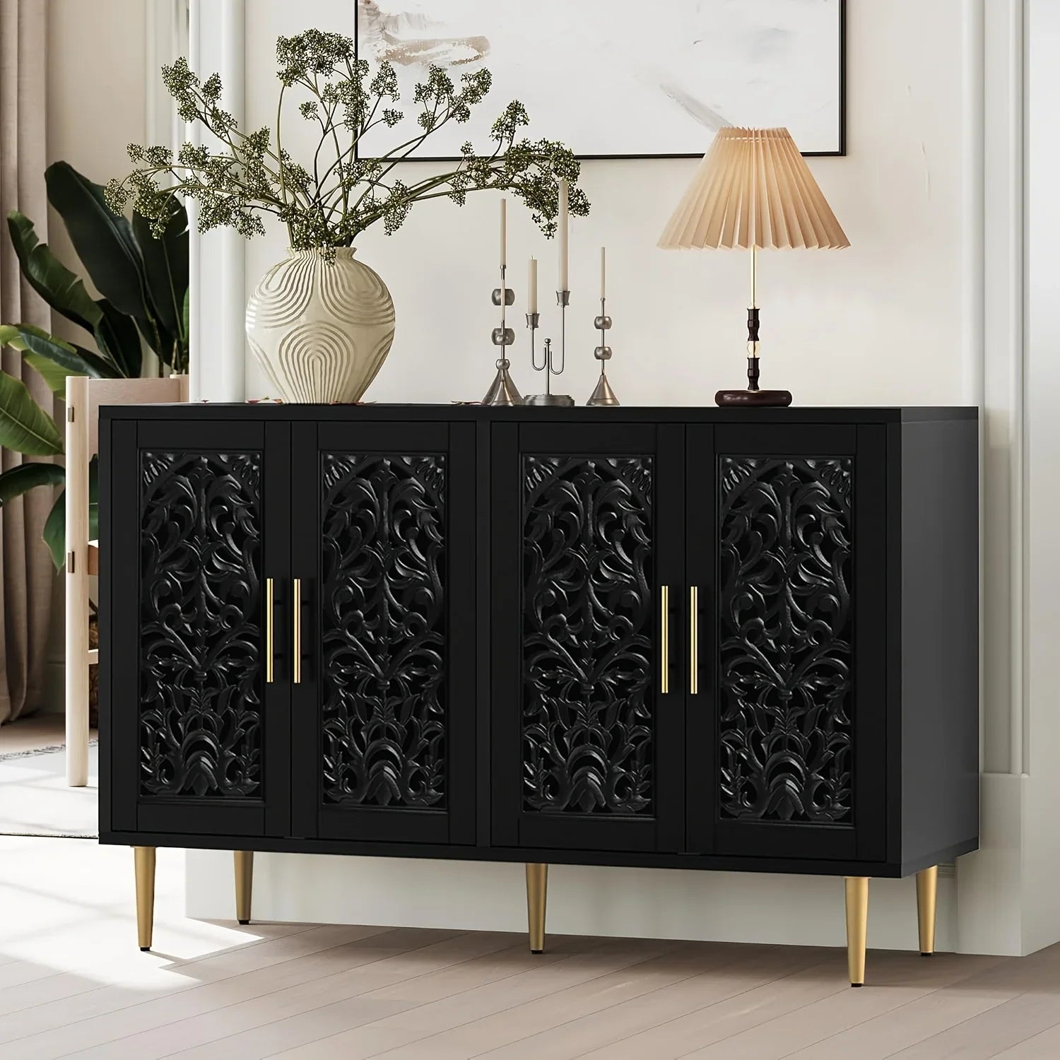Black decorative cabinet with gold accents in a room setting.