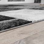 Grey and black area rug with contour cut edges, checkered pattern - House of Avana