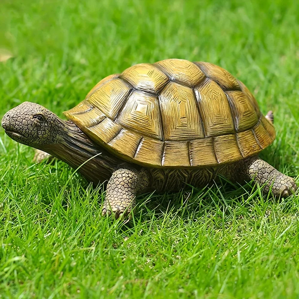 Realistic resin turtle garden statue with detailed shell texture sitting on green grass for outdoor backyard decoration. [[SKU:HOA-GSC-004]]
