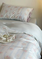 Bianca Floral Ribbon Tied Tencel™ Bedding Set / Ivory Blue, close-up view - House Of Avana