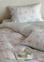 Bianca Floral Ribbon Tied Tencel™ Bedding Set / Ivory Blue, angled view - House Of Avana