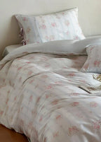 Bianca Floral Ribbon Tied Tencel™ Bedding Set / Ivory Blue, angled view - House Of Avana