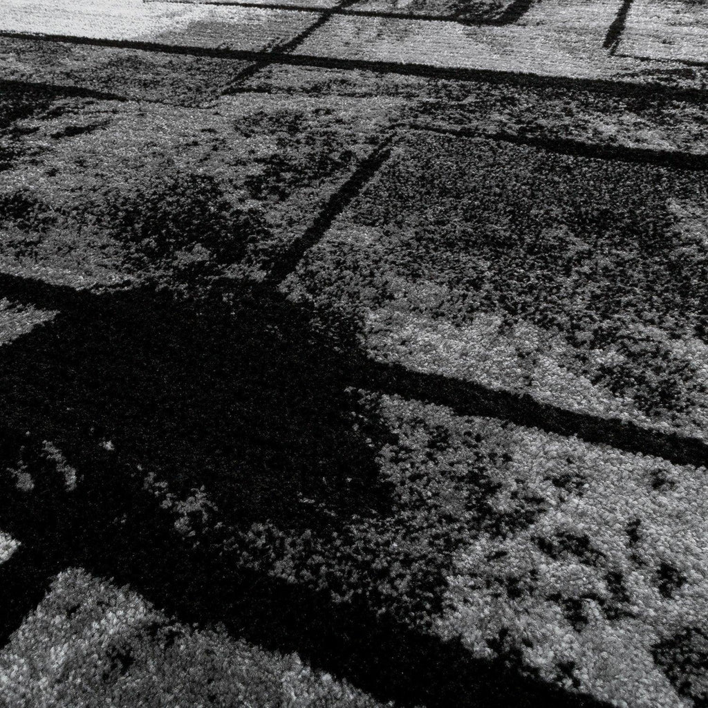 Black and white area rug with abstract paint effect, plush material - House of Avana