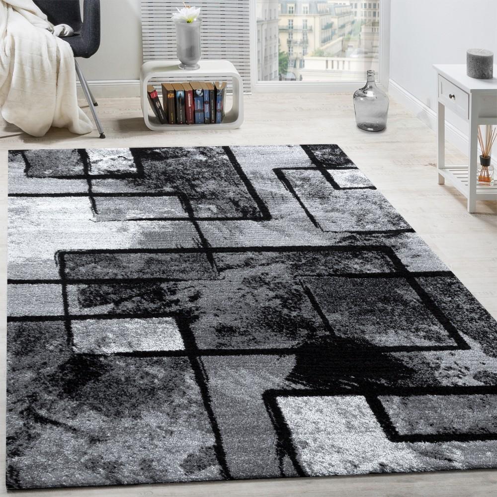 Black and white area rug with abstract paint effect, plush material - House of Avana