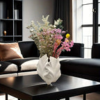 White ceramic vase with textured leaf design, oval shape - House of Avana