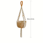 Handwoven bohemian macrame plant hanger with decorative basket and tassel measuring 90cm.