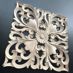 Natural rubberwood wall plaque with intricate floral carvings, unfinished wooden decor - House of Avana