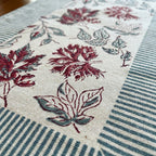 Burgundy & Slate Blue Indian floral print fabric texture close-up | handmade Jaipur handicraft table runners table mats napkins hand block India natural colors aesthetics | House of Avana