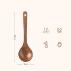 A smooth medium brown wooden cooking spoon with a rounded bowl and a handle hole for hanging in eco friendly wooden cooking spoons