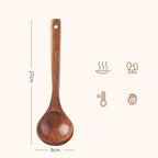 A smooth rich brown eco friendly wooden cooking spoon with a rounded bowl and a hole in the handle