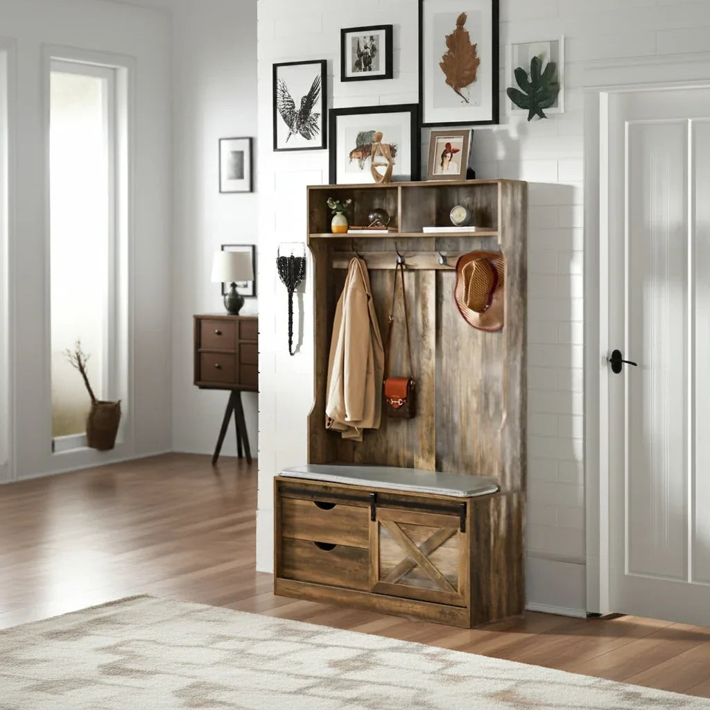 Wooden entryway console with coat hooks and storage drawers in a home setting.