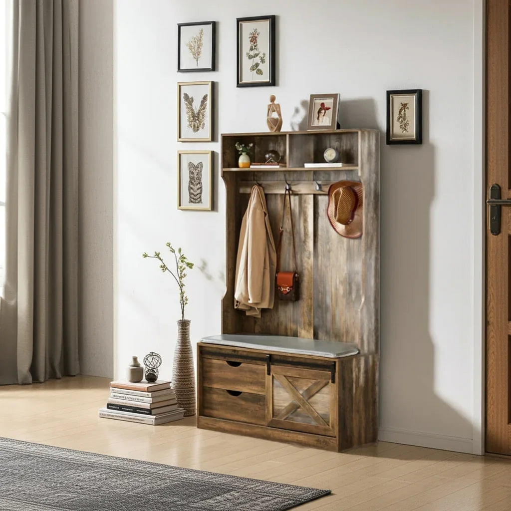 Wooden entryway console with coat rack and bench in a room with framed artwork on the wall.