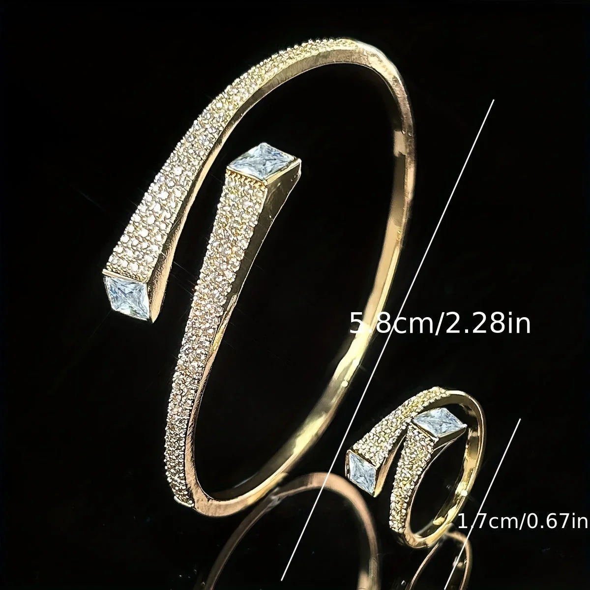 Gold-tone open bracelet and ring set featuring shiny irregular geometric synthetic zirconia stones.