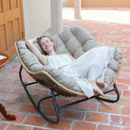 Brown rattan outdoor sofa with beige weather-resistant cushions - House of Avana