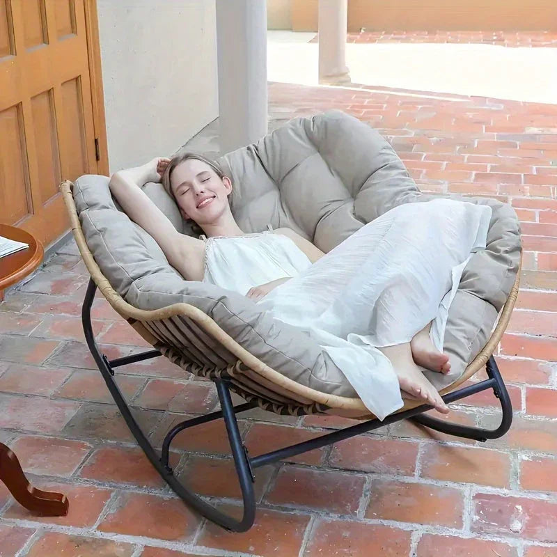 Brown rattan outdoor sofa with beige weather-resistant cushions - House of Avana