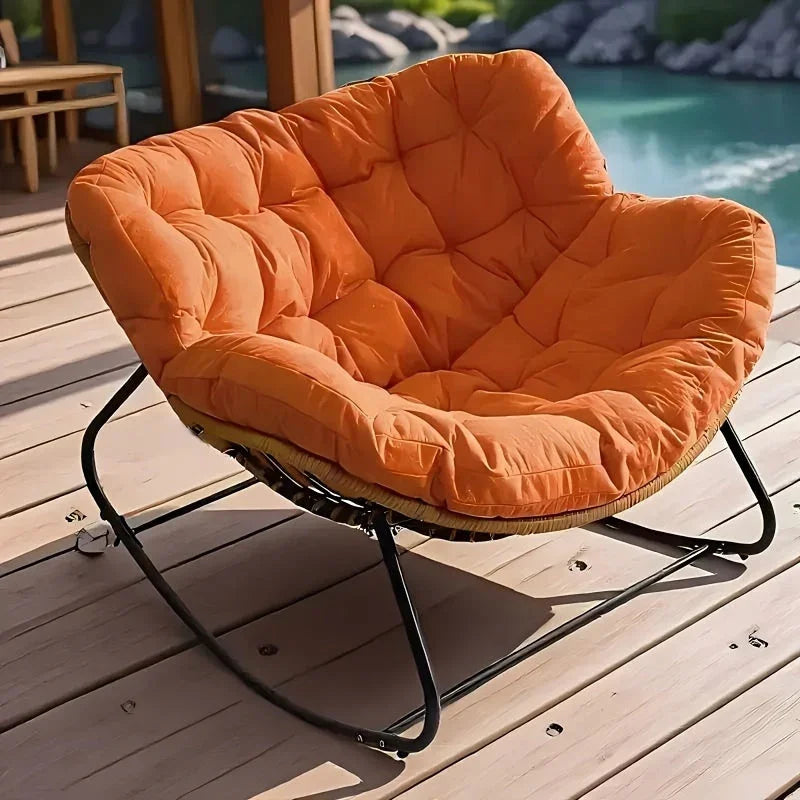 Brown rattan outdoor sofa with beige weather-resistant cushions - House of Avana