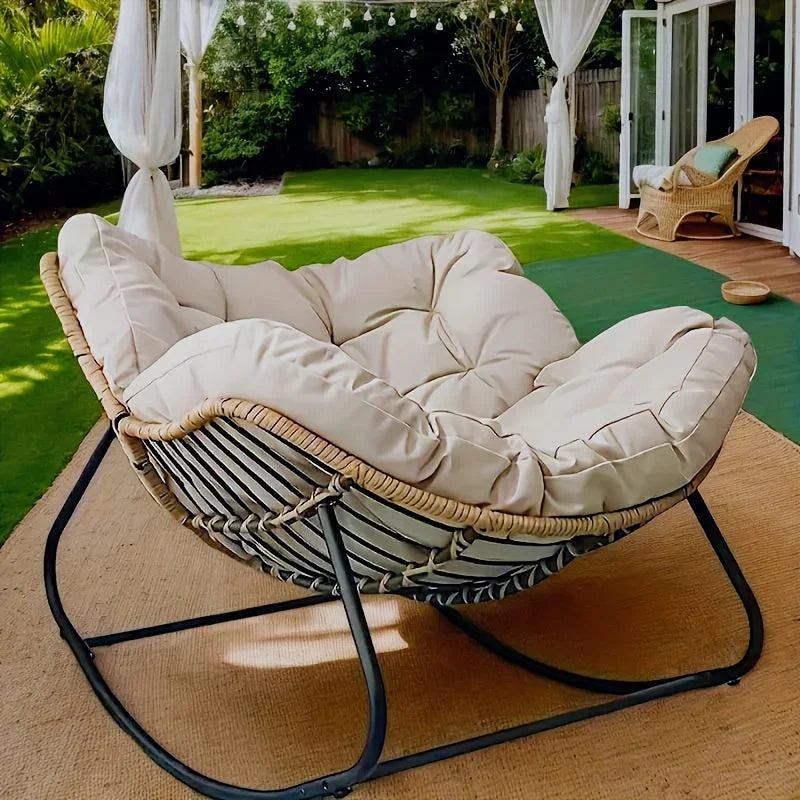 Brown rattan outdoor sofa with beige weather-resistant cushions - House of Avana