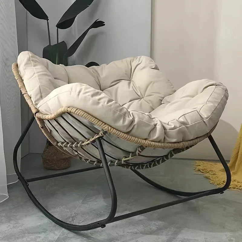 Brown rattan outdoor sofa with beige weather-resistant cushions - House of Avana