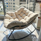 Brown rattan outdoor sofa with beige weather-resistant cushions - House of Avana