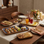 Mango wood hand made trays used as a serve ware on a dining table 