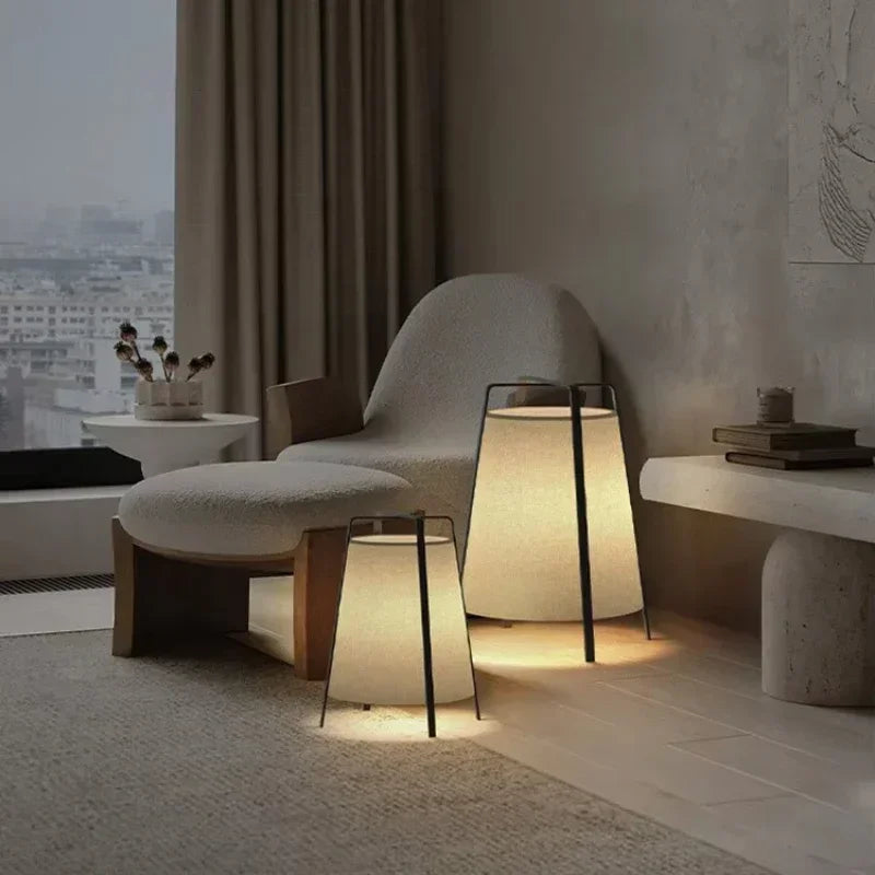 Japanese style Wabi Sabi fabric floor lamp with hand-knitted shade and warm LED light in a minimalist room.