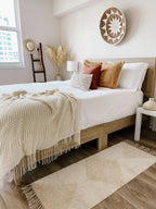 Soft gray Khera throw blanket, woven natural fibers, fringed edges - House of Avana