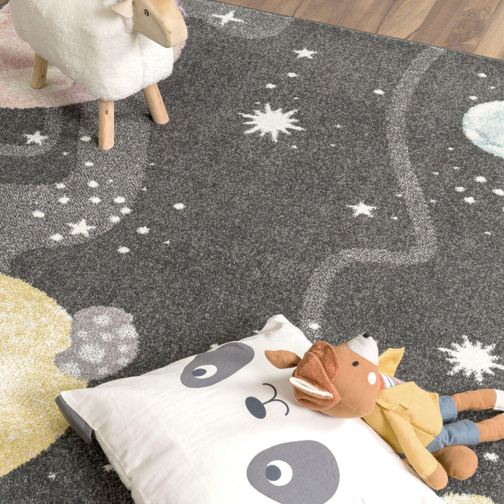 Kids Rug Nino Space with Pastel Colored Planets Stars in Anthracite, back view - House Of Avana