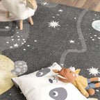 Kids Rug Nino Space with Pastel Colored Planets Stars in Anthracite, back view - House Of Avana