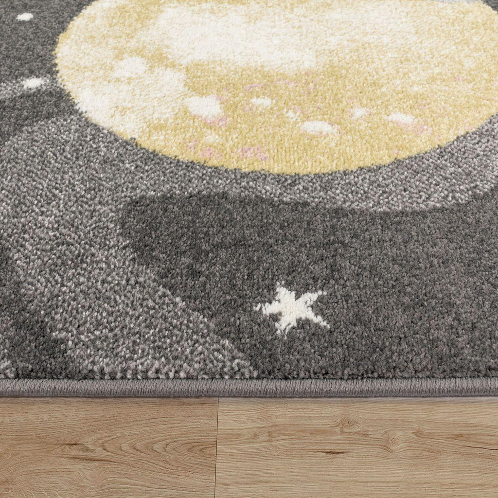 Kids Rug Nino Space with Pastel Colored Planets Stars in Anthracite, side view - House Of Avana